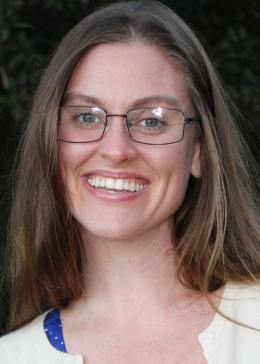 Woman smiles for camera.